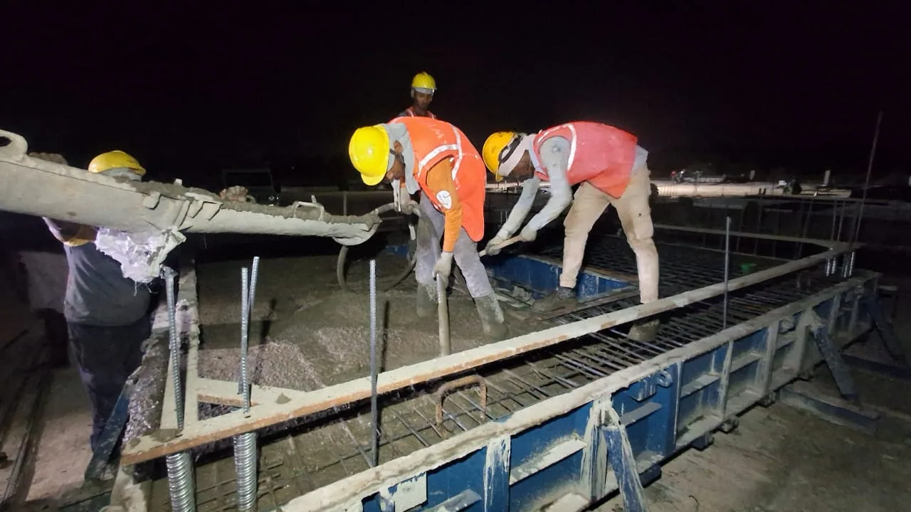 Concrete placement and vibration by the pour crew — Fortico Infra solar project site
