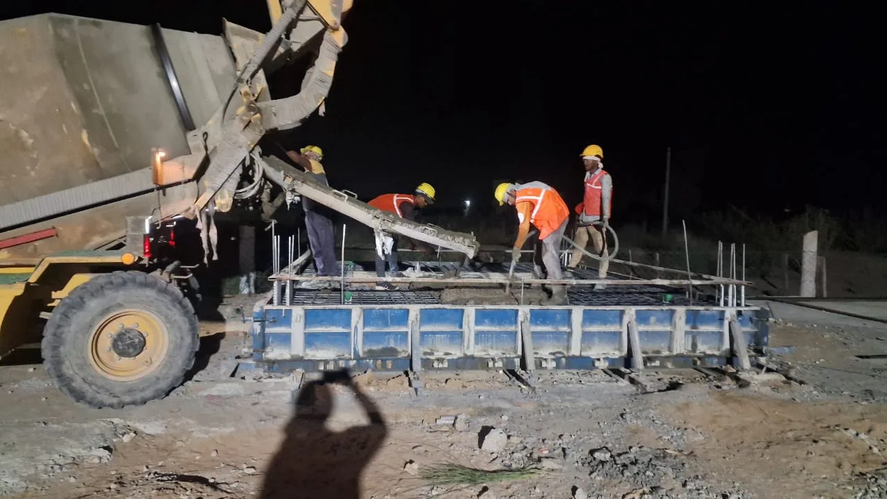 Transit mixer supplying a night pour — Fortico Infra solar project site