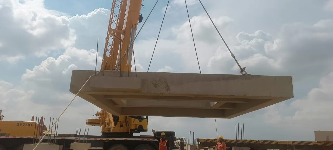 Precast wall panels lifted from transport bed — Fortico Infra solar project site