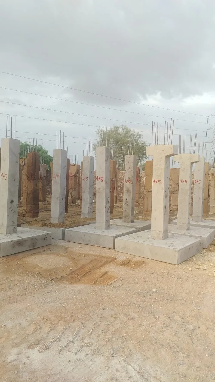 Row of erected precast columns across the plant grid — Fortico Infra solar project site